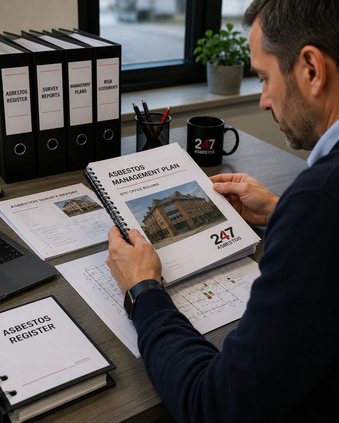 Asbestos Management Plan for Duty Holders Duty holder reviewing an asbestos management plan and building survey documentation