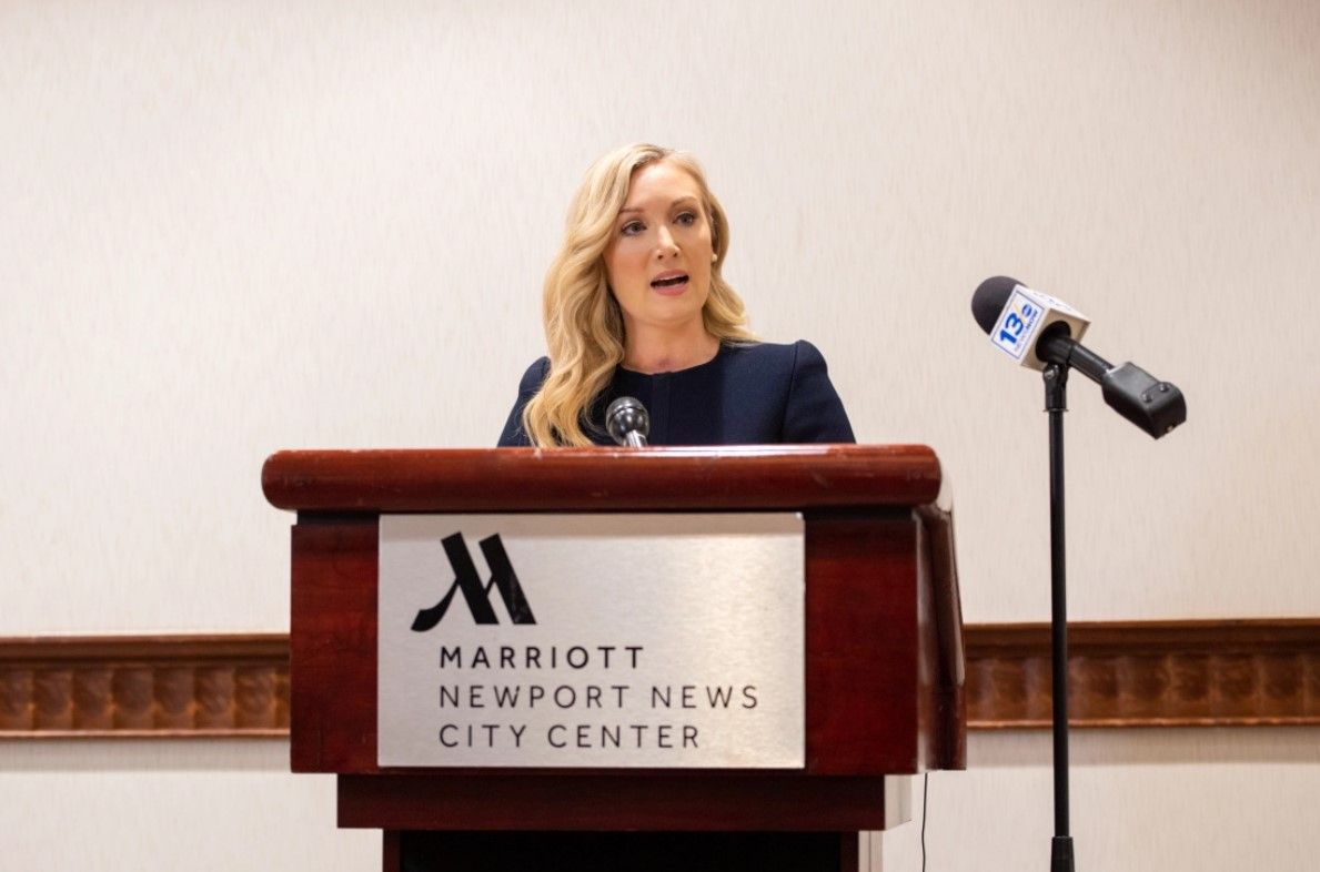 Diane Toscano speaking on a podium