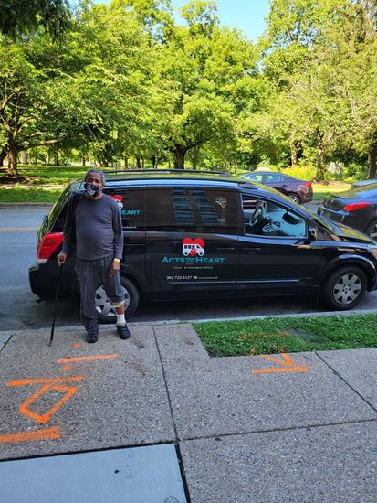 Man Standing Next To Car — Smyrna, DE — Acts From The Heart
