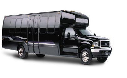 Black passenger shuttle bus with tinted windows on a white background