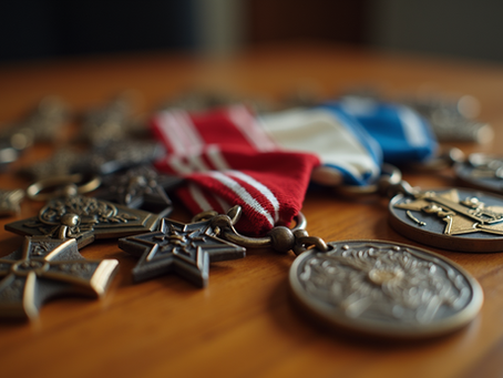 Medals and star-shaped pendants with red, white, and blue ribbons on a wooden table