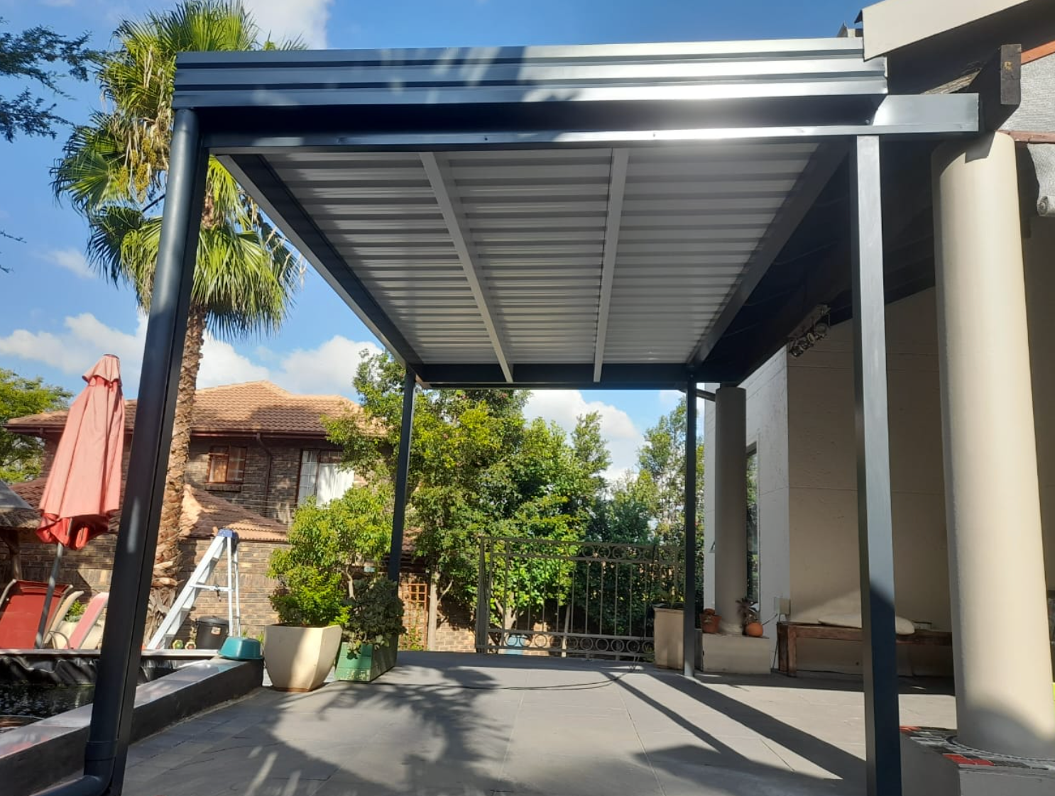 Beautiful covered patio with awning in South Africa — Awning Warehouse
