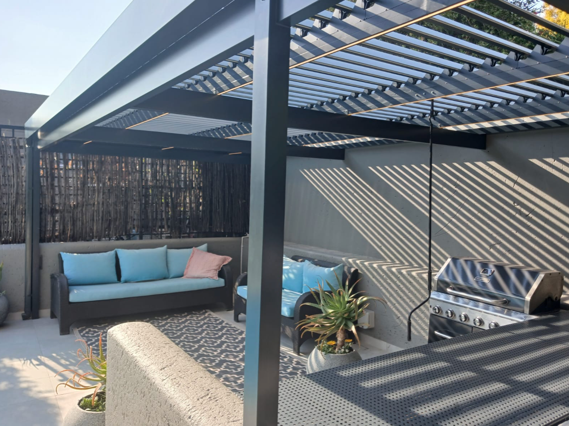 Awning Warehouse folding arm awning installed over residential patio South Africa — pricing and cost