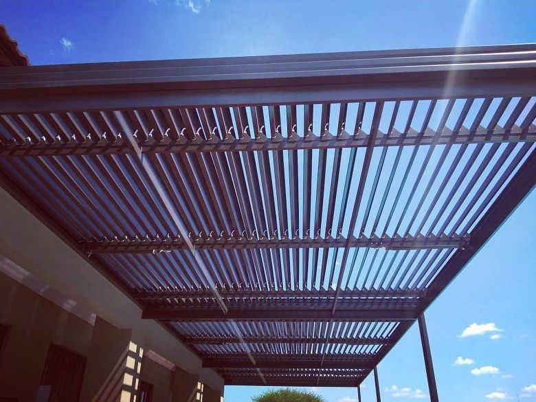 Clean and well-maintained patio awning on a South African home — Awning Warehouse