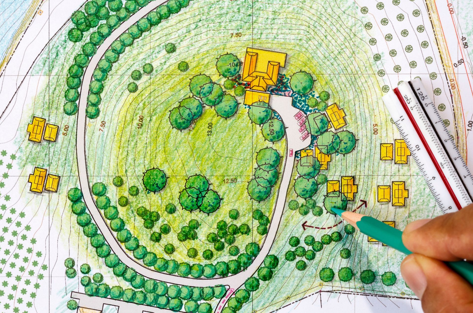 Young male landscape designer working in office. Young male landscape designer working in office.