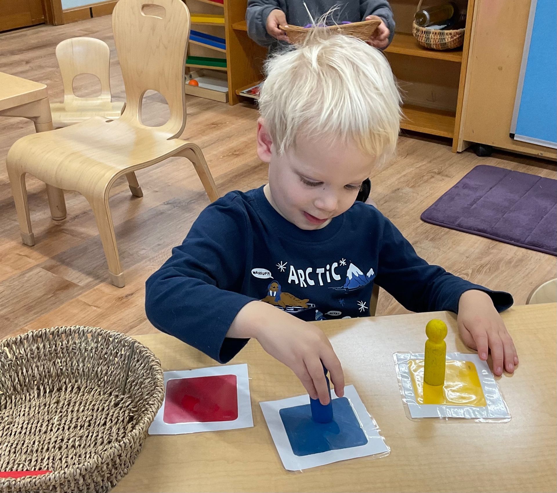 Montessori child working with montessori materials