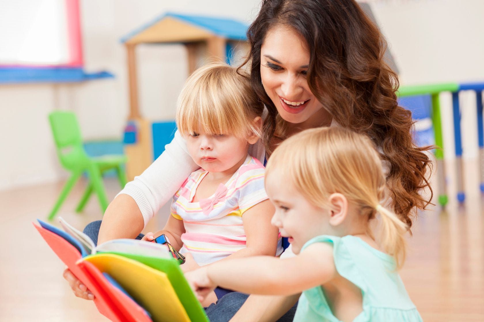 Montessori guide and Montessori infant during lessons