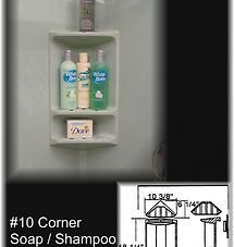 White corner shower shelf holding shampoo, conditioner, and Dove soap.