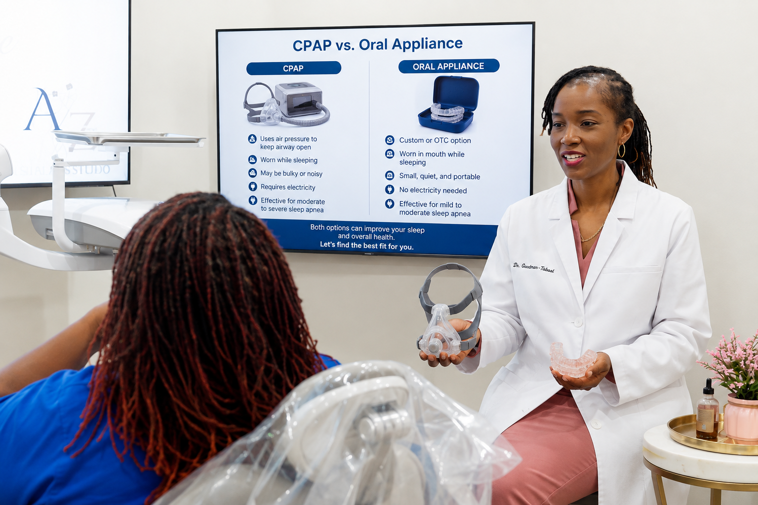 Dentist showing CPAP vs. oral appliance slide to patient in a dental office