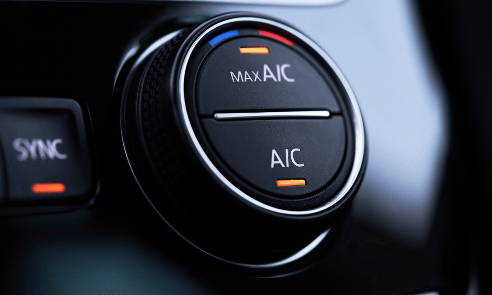 Car climate control knob set to max A/C inside vehicle dashboard