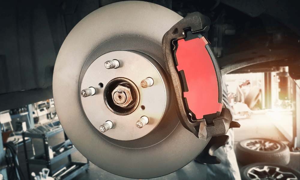 Close-up of brake rotor and brake pad during replacement service