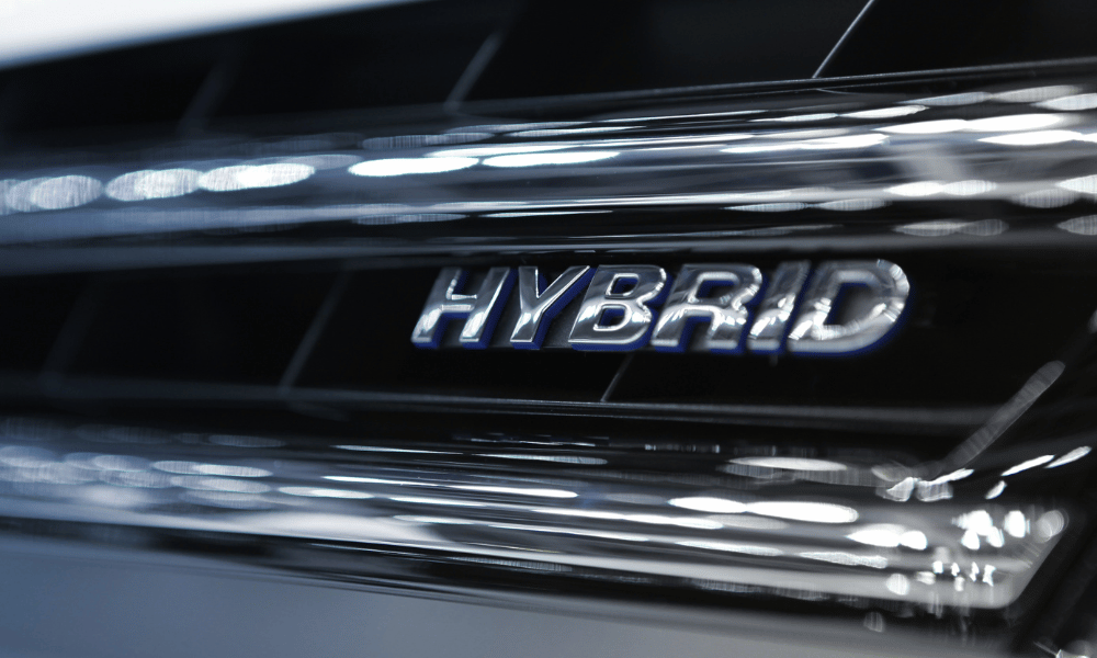 Hybrid vehicle badge close-up on front grille