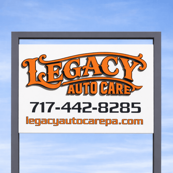 Legacy Auto Care roadside sign with phone number 717-442-8285 and website legacyautocarepa.com