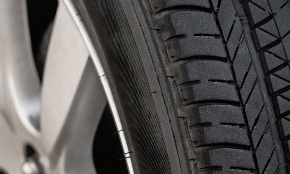 Close-up of tire tread showing wear pattern on vehicle