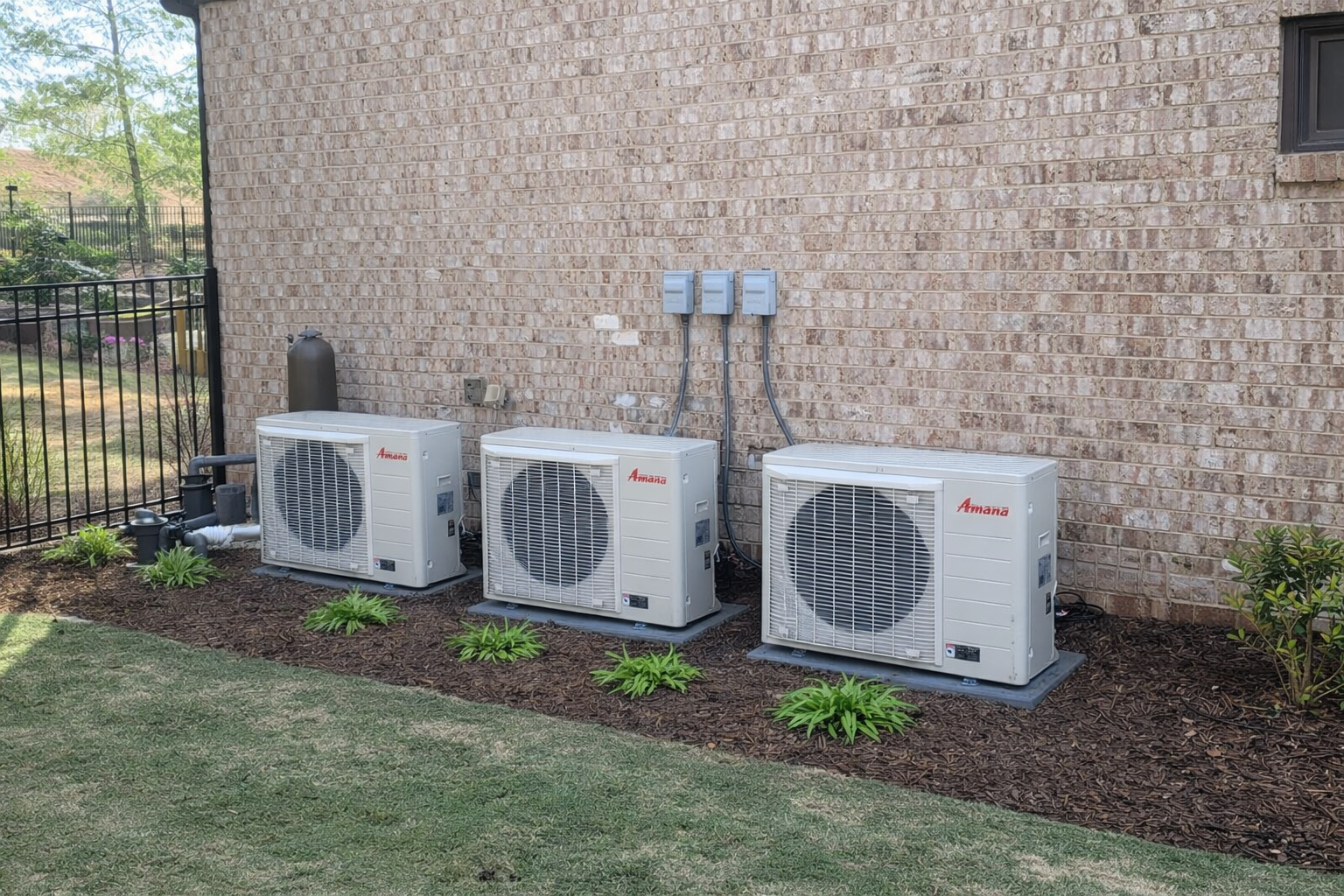Three story house with three Amana hvac units outside that were recently installed after their hvac units couldnt be repaired