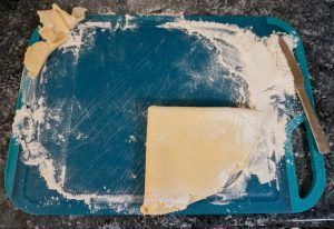 Blue tray with white powdery residue and a beige rectangular block on top