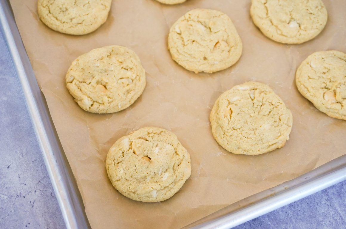 Freshly baked cookies on parchment-lined baking sheet