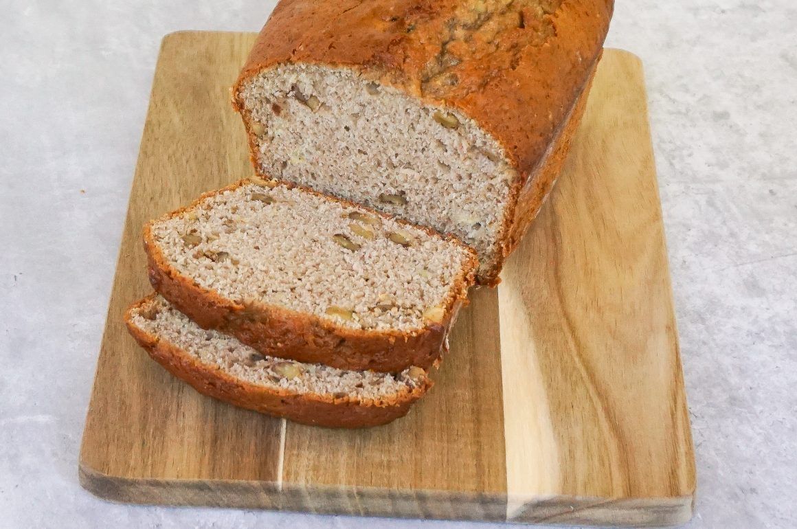 Sliced loaf of bread on a wooden cutting board
