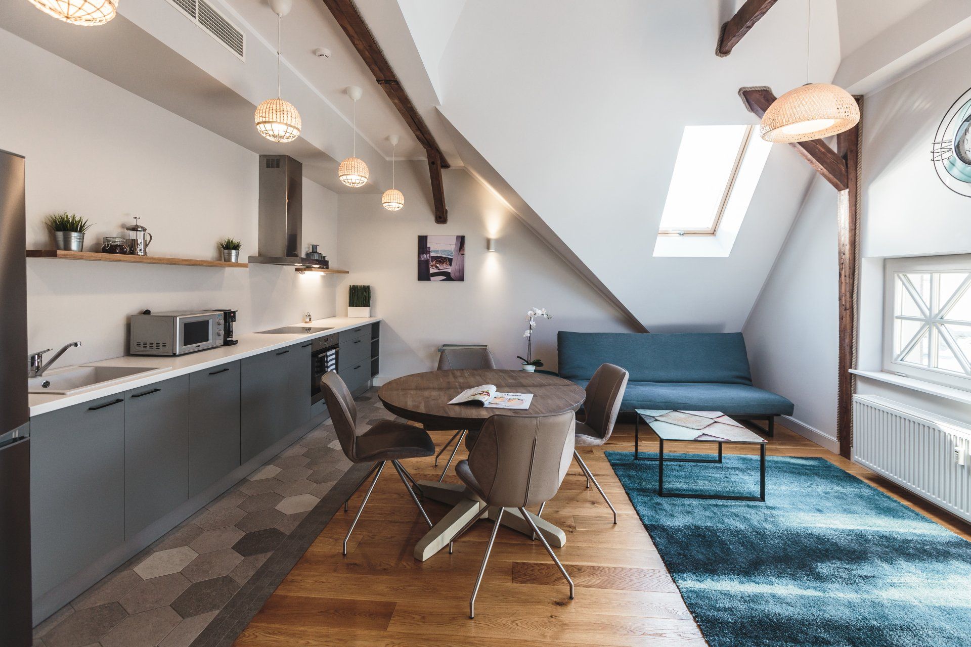 A kitchen with a table and chairs in it
