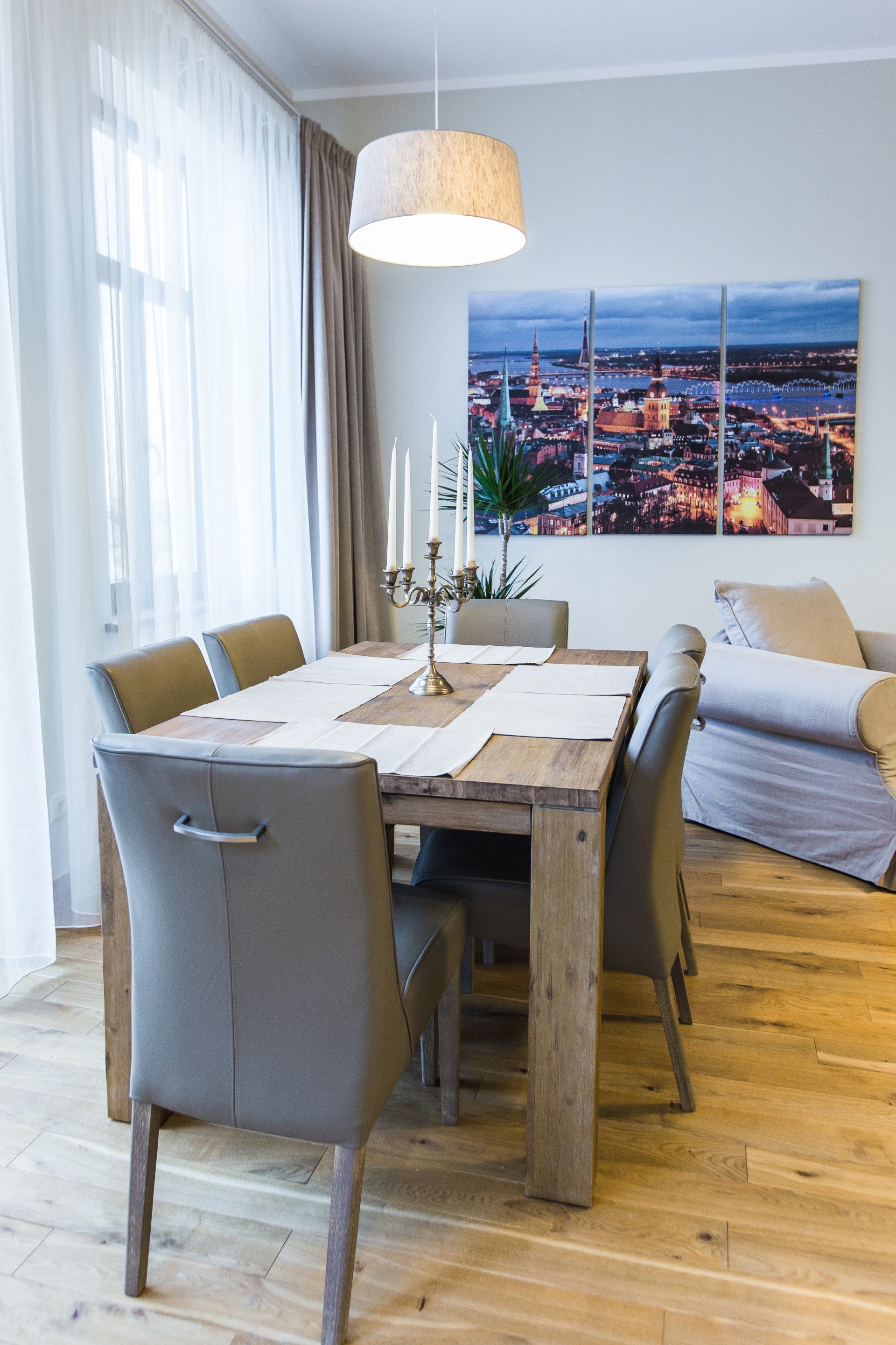 There is a dining table and chairs in the living room.