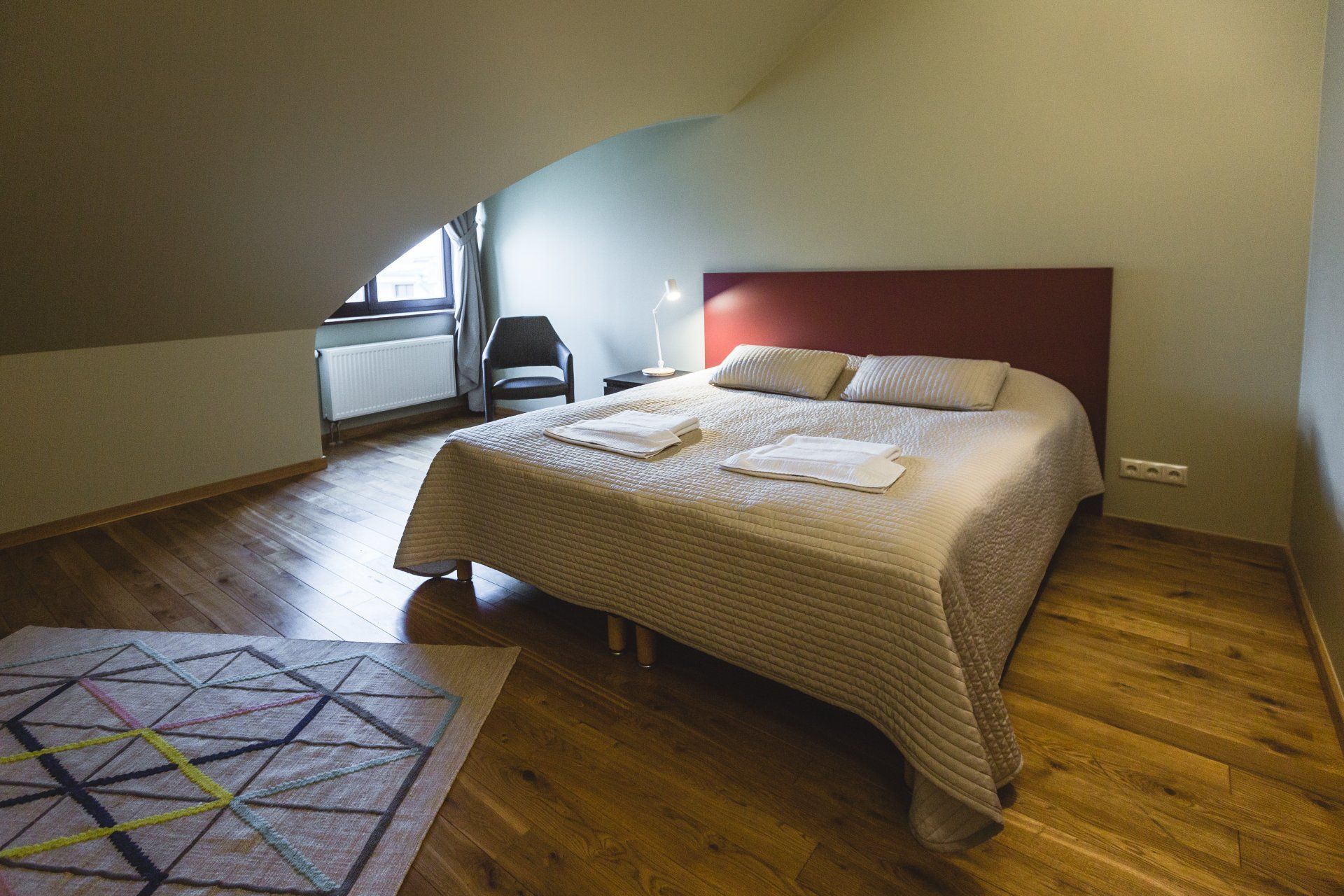 There is a bed in the middle of the room.