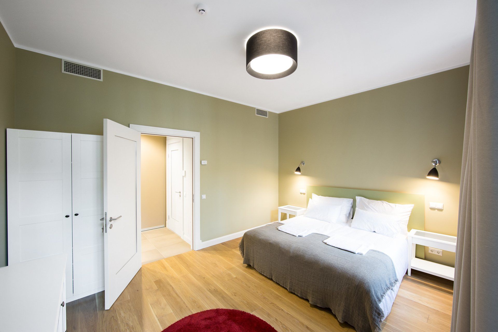 There is a large bed in the middle of the room.