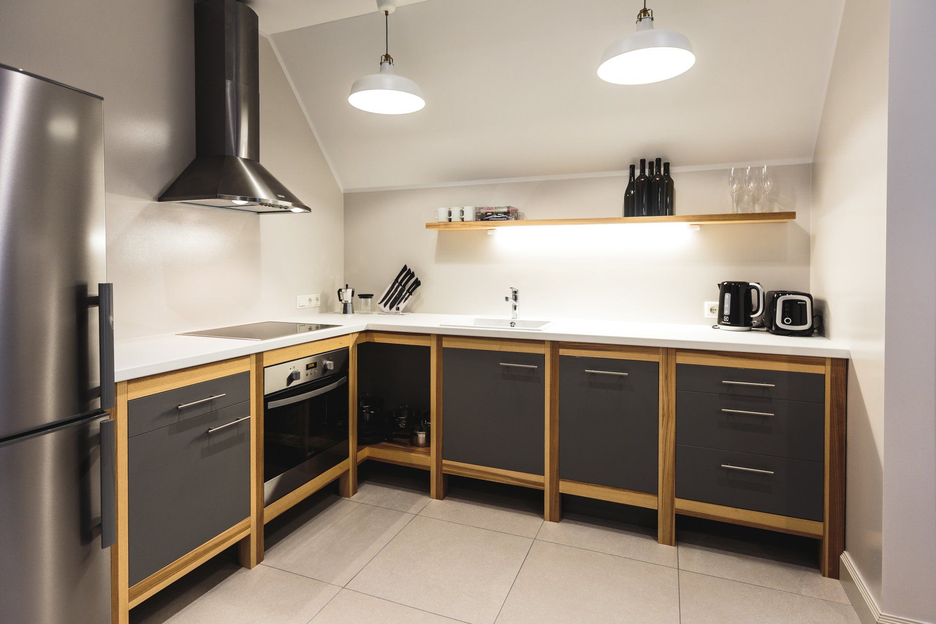 A kitchen with stainless steel appliances and wooden cabinets