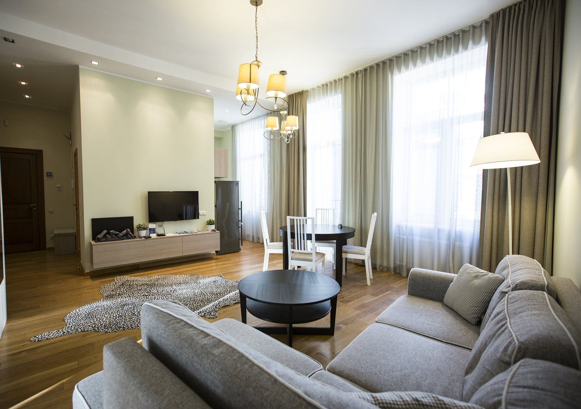 A living room with a couch , table and television