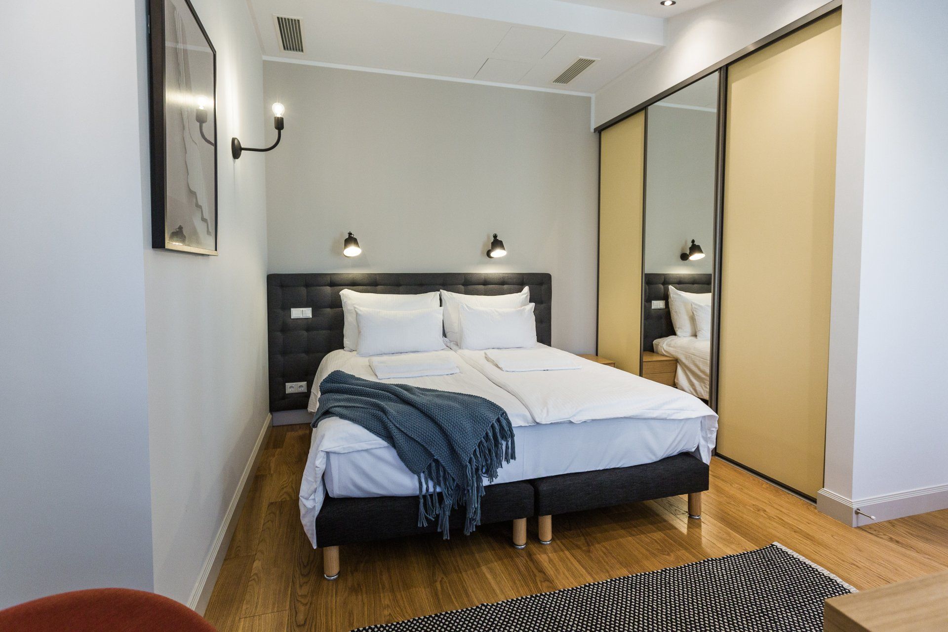 There is a large bed in the middle of the room.