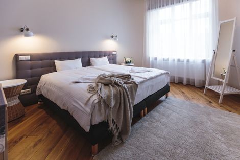 There is a large bed in the middle of the room.