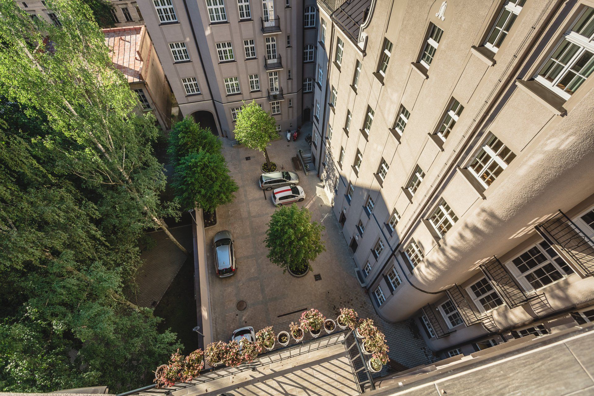 An aerial view of a city with lots of buildings and trees