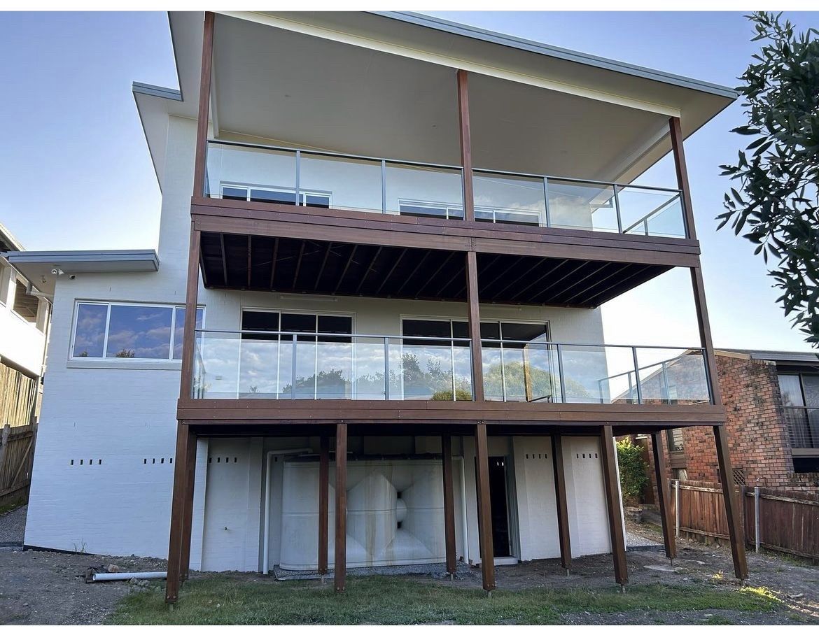 Stainless Steel With Glass Railing: Modern and sleek Railing Option for Contemporary Spaces — Fabricator In Coffs Harbour, NSW
