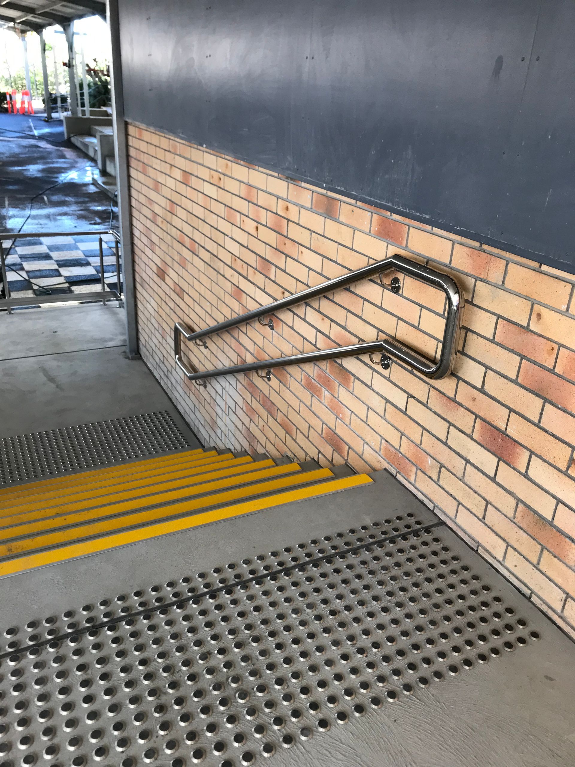 A brick wall with stairs and a metal railing — Fabricator In Coffs Harbour, NSW