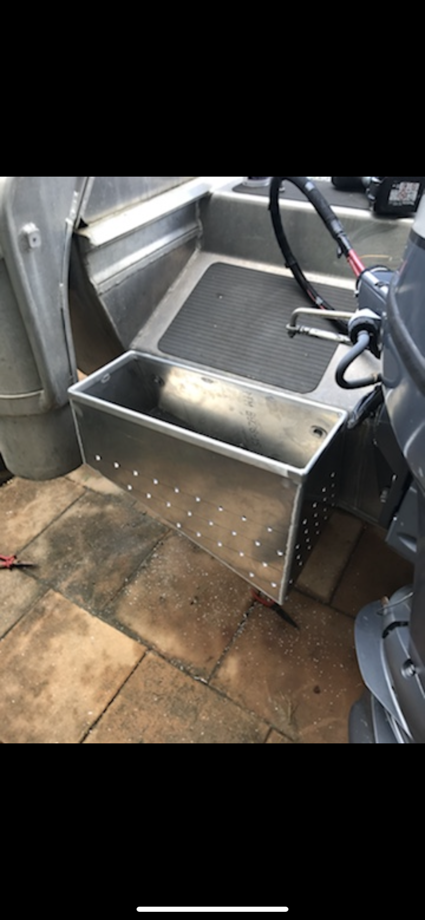 A metal box is sitting on the side of a boat — Fabricator In Coffs Harbour, NSW