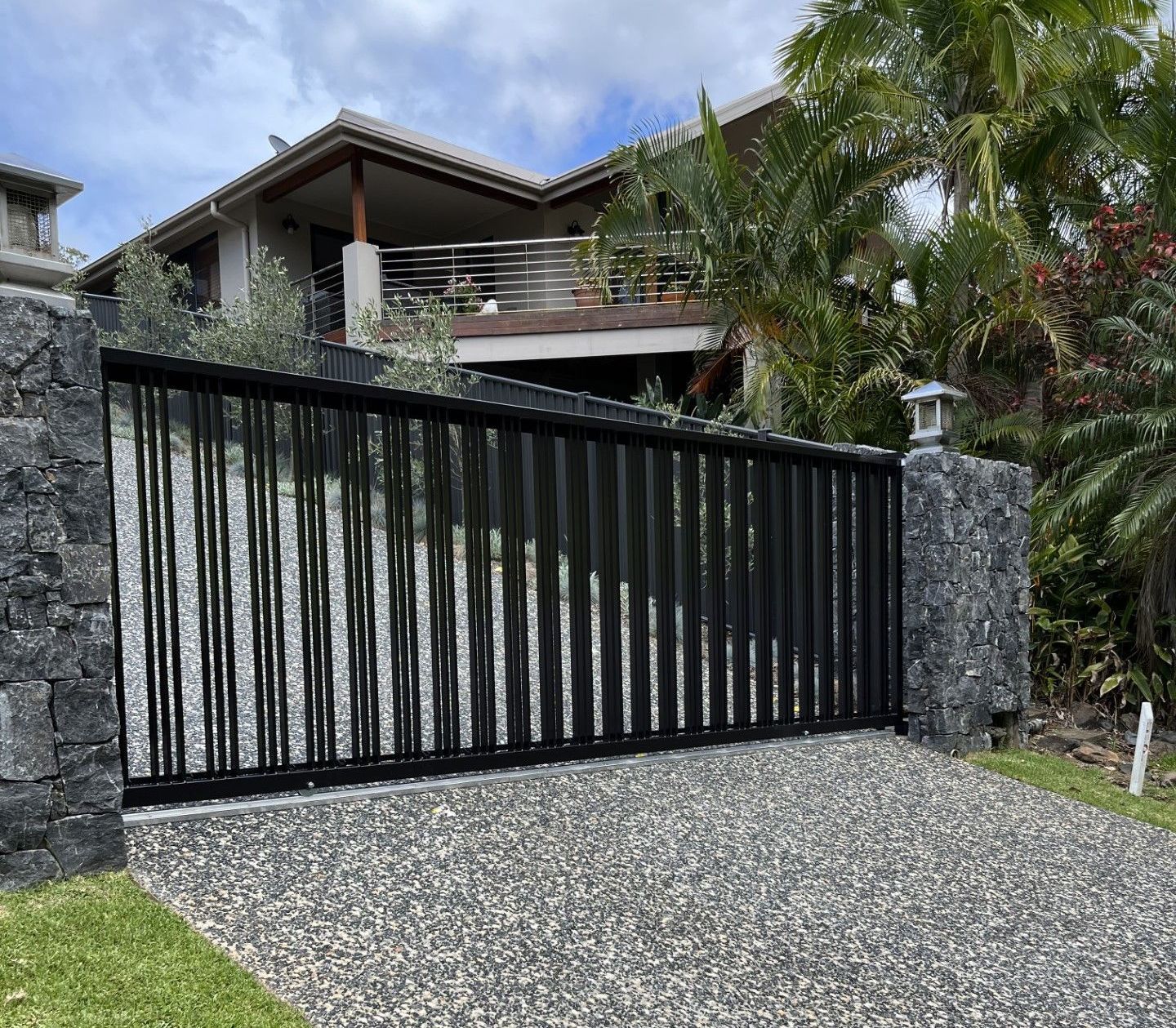 Black Automatic Gate with Concrete Driveway — Fabricator In Coffs Harbour, NSW