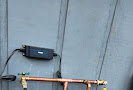 A pipe is being installed in the dirt at a construction site.