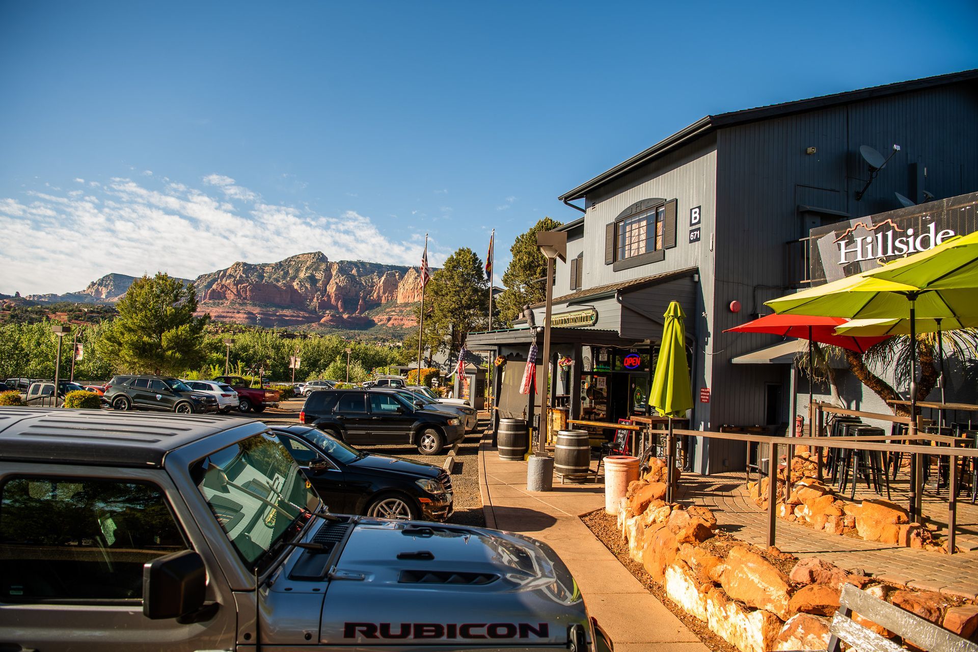 Cars parked near a gray building, 