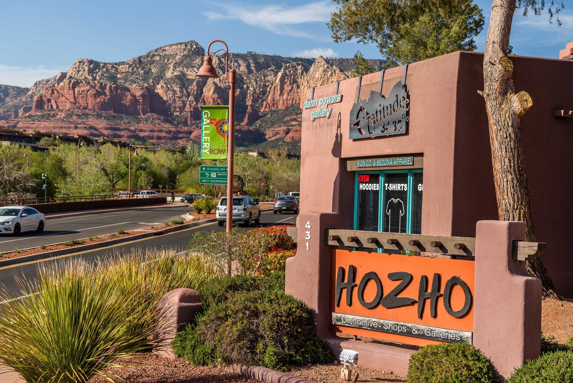 Sign for Hozho restaurant in Sedona, Arizona, with red rock mountain backdrop.