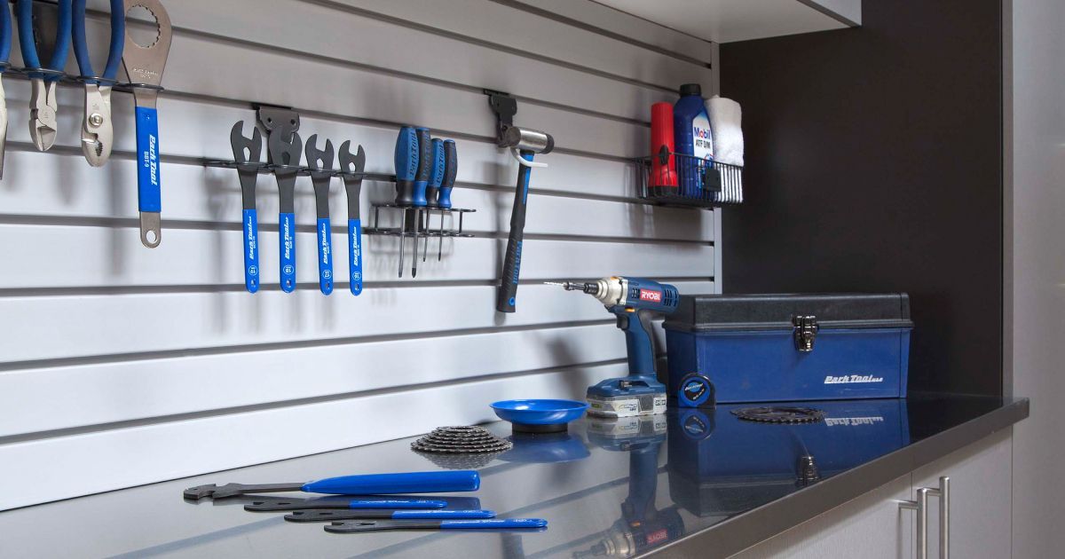 Workbench with blue hand tools and toolbox in a garage workshop