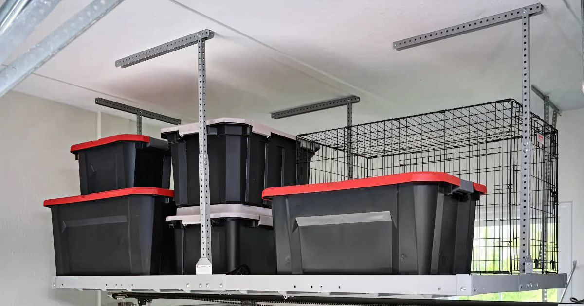 Garage storage shelves with various black storage bins, cooler, and ladder.