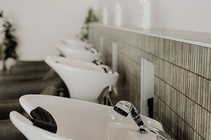 A Row Of White Sinks In A Hair Salon — Rowe Street Collective In Shepparton, VIC