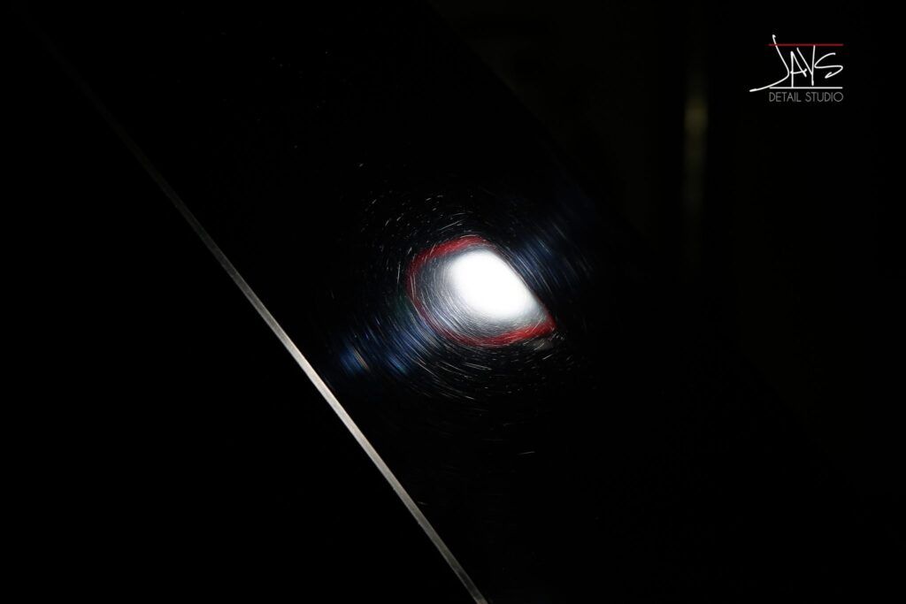 Bright light within a dark setting, potentially a welding torch in use.