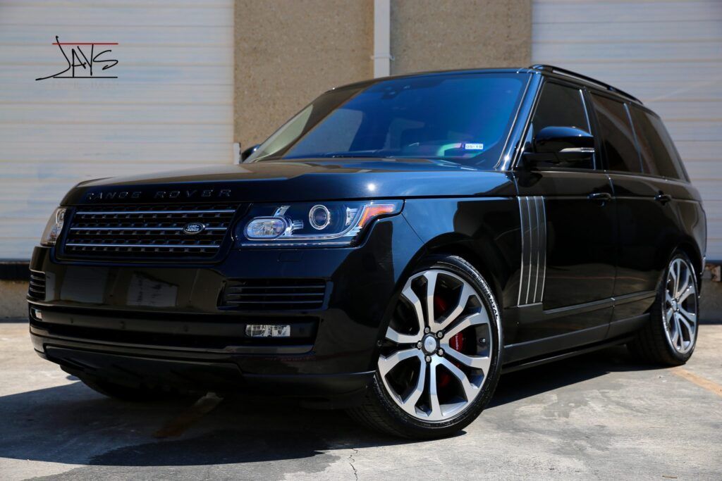 Black Range Rover SUV parked outside.