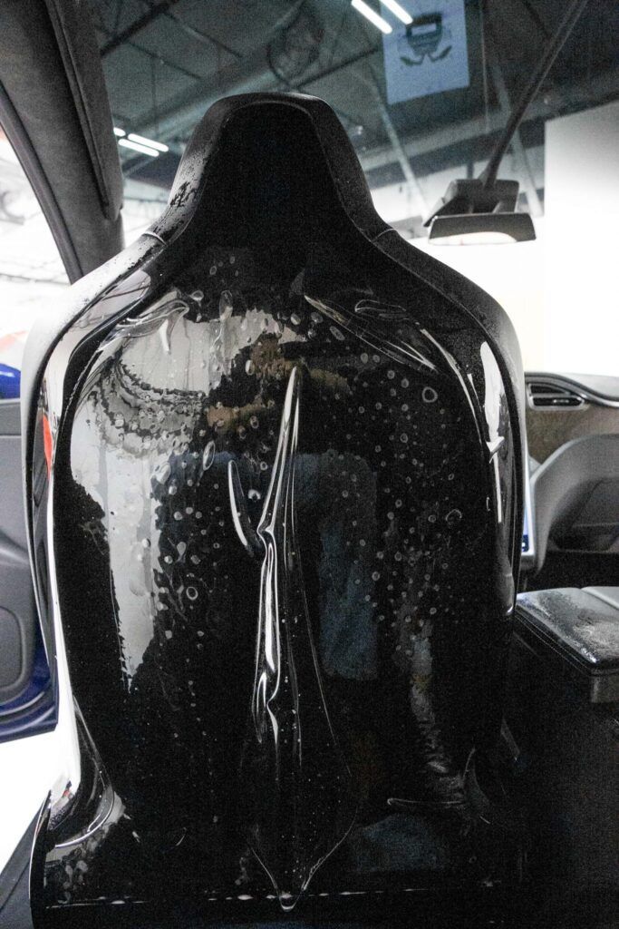 Black glossy car seat back.