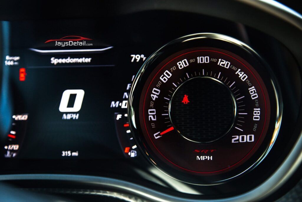 Dashboard of a Dodge Challenger displaying speedometer at 0 MPH.