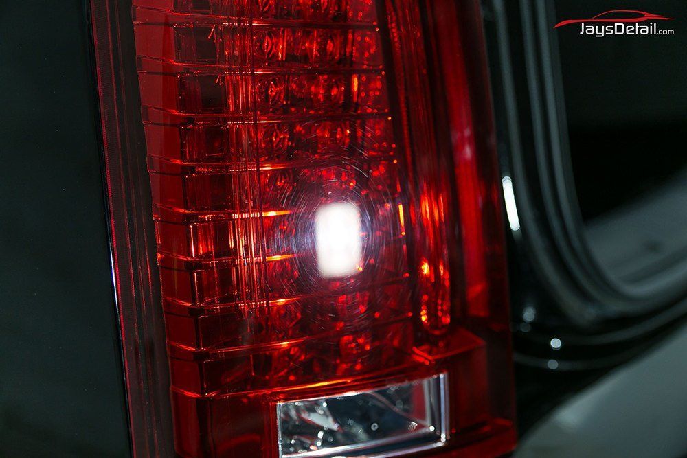 Red car tail light, shiny and detailed.