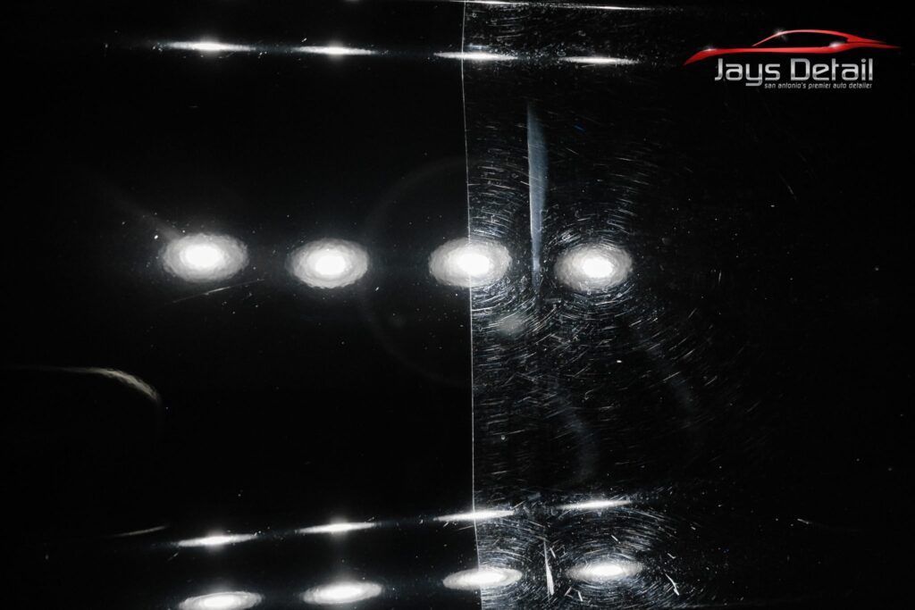 Car paint surface: Left side polished, reflecting lights; right side scratched and dull.