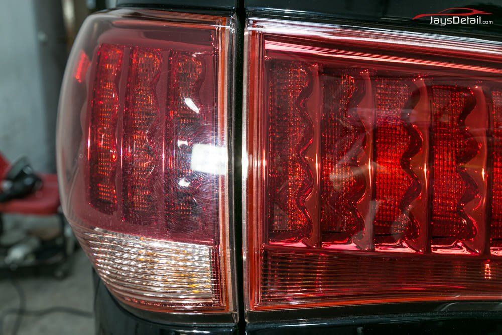 Comparison of two car taillights, one with vertical LEDs, the other with horizontal, both red.