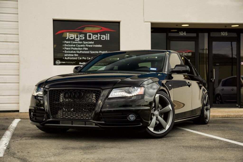 Black Audi parked in front of