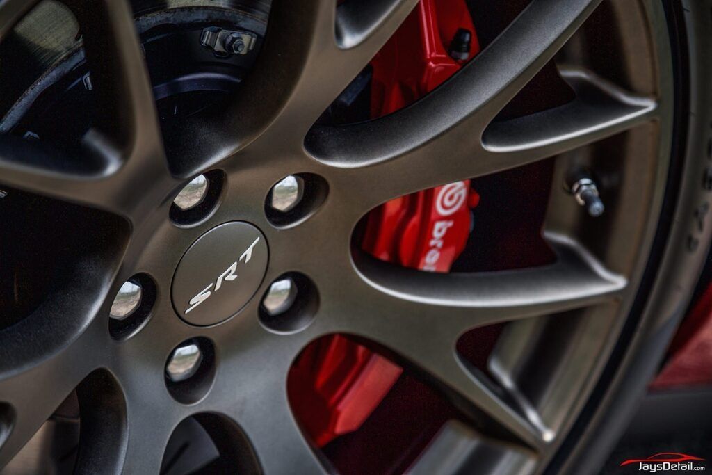 Close-up of a dark gray car rim with the 